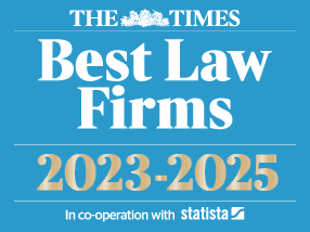 The logo has a sky-blue background consisting of four lines written in white and gold. The first line has The Times newspaper logo. The second line states "Best Law Firms" The third line is written in white and gold "2023-2025" . The fourth line prints "In co-operation with Statista" in small writing. 