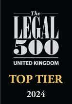 The logo has a black background consisting of one section written in light grey and another one in golden. The first section has The Legal 500 United Kingdom typed in big letters. The second section states "Top Tier 2024" in capitalised, average-sized letters. 